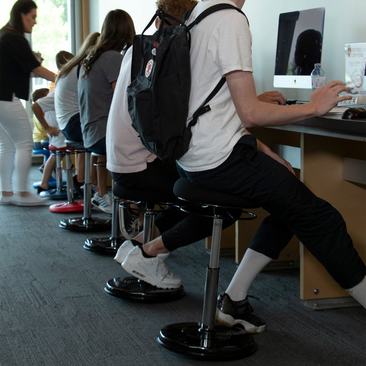 College Adjustable Black Wobble Chair in daily use