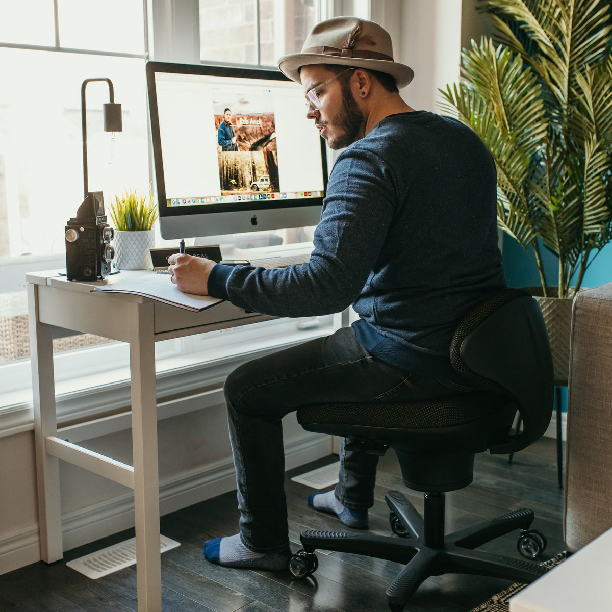 Man working at his desk on a CoreChair Classic