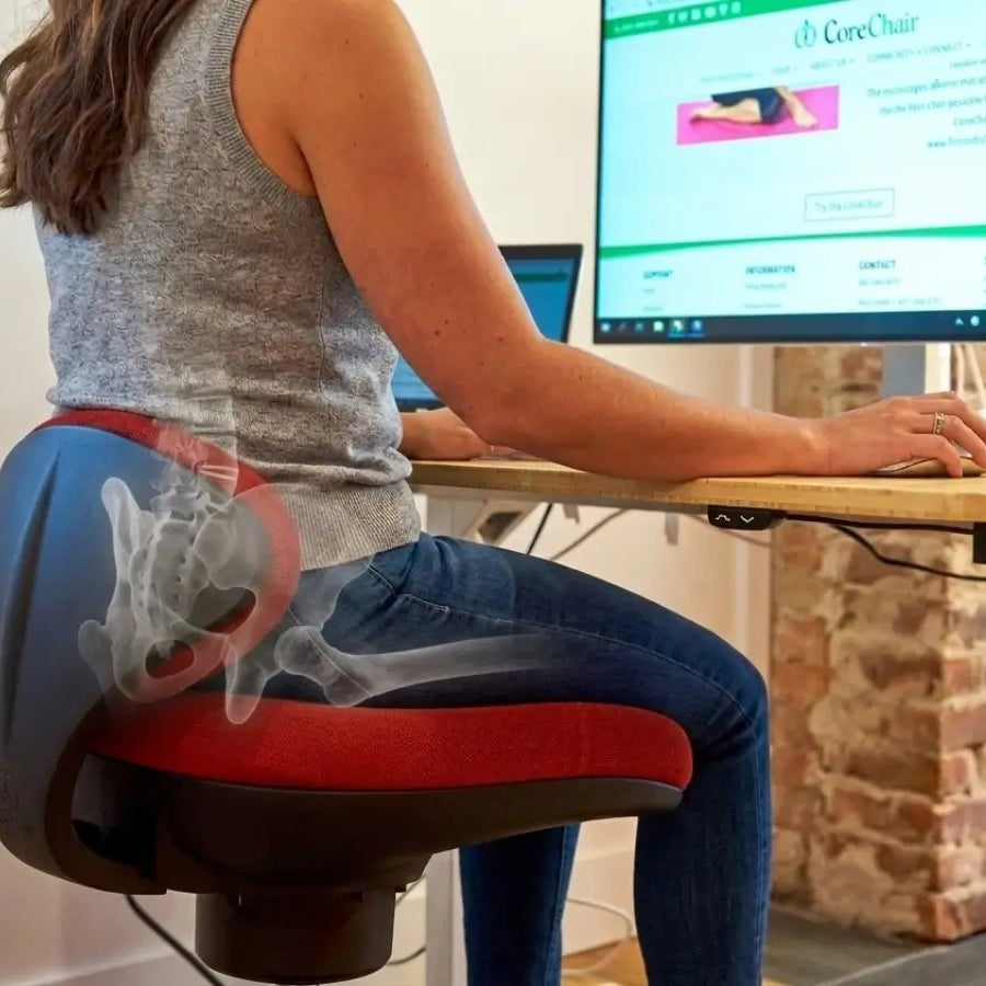 Woman at her desk on a Red CoreChair Tango with overlay showing pelvic alignment