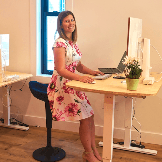 CorePerch Active Stool perching at office standing desk by Active Goods Canada