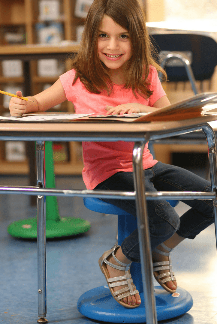 Girl using Kore Pre-School Wobble Chair 12" in classroom from Active Goods Canada