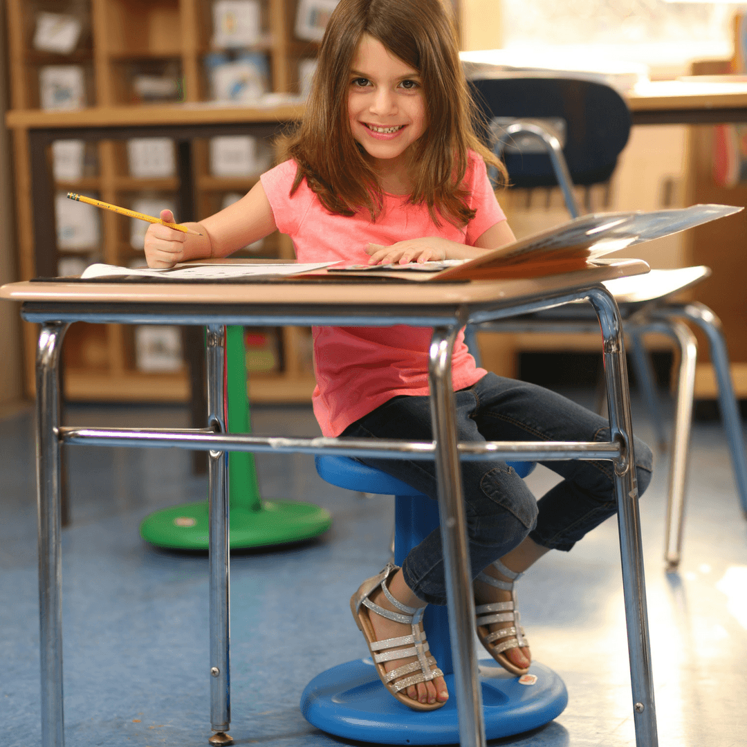 Girl using Kore Pre-School Wobble Chair 12" in classroom from Active Goods Canada