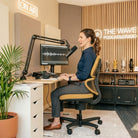 Woman sitting upright at her desk on an Ochre CoreChair Elite