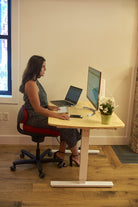 CoreChair Tango in Red at office desk from Active Goods Canada