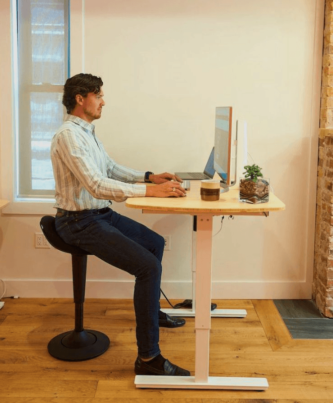 CorePerch Active Stool sitting down at office desk by Active Goods Canada