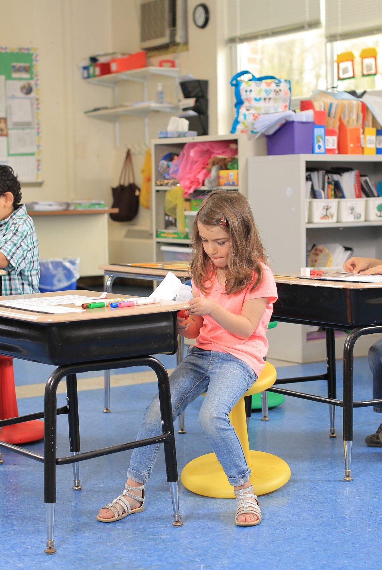 Children using Kore Pre-School Wobble Chair 12" in classroom from Active Goods Canada