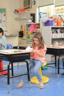 Kids using Kore Pre-Teen Wobble Chair 18.7" in classroom from Active Goods Canada