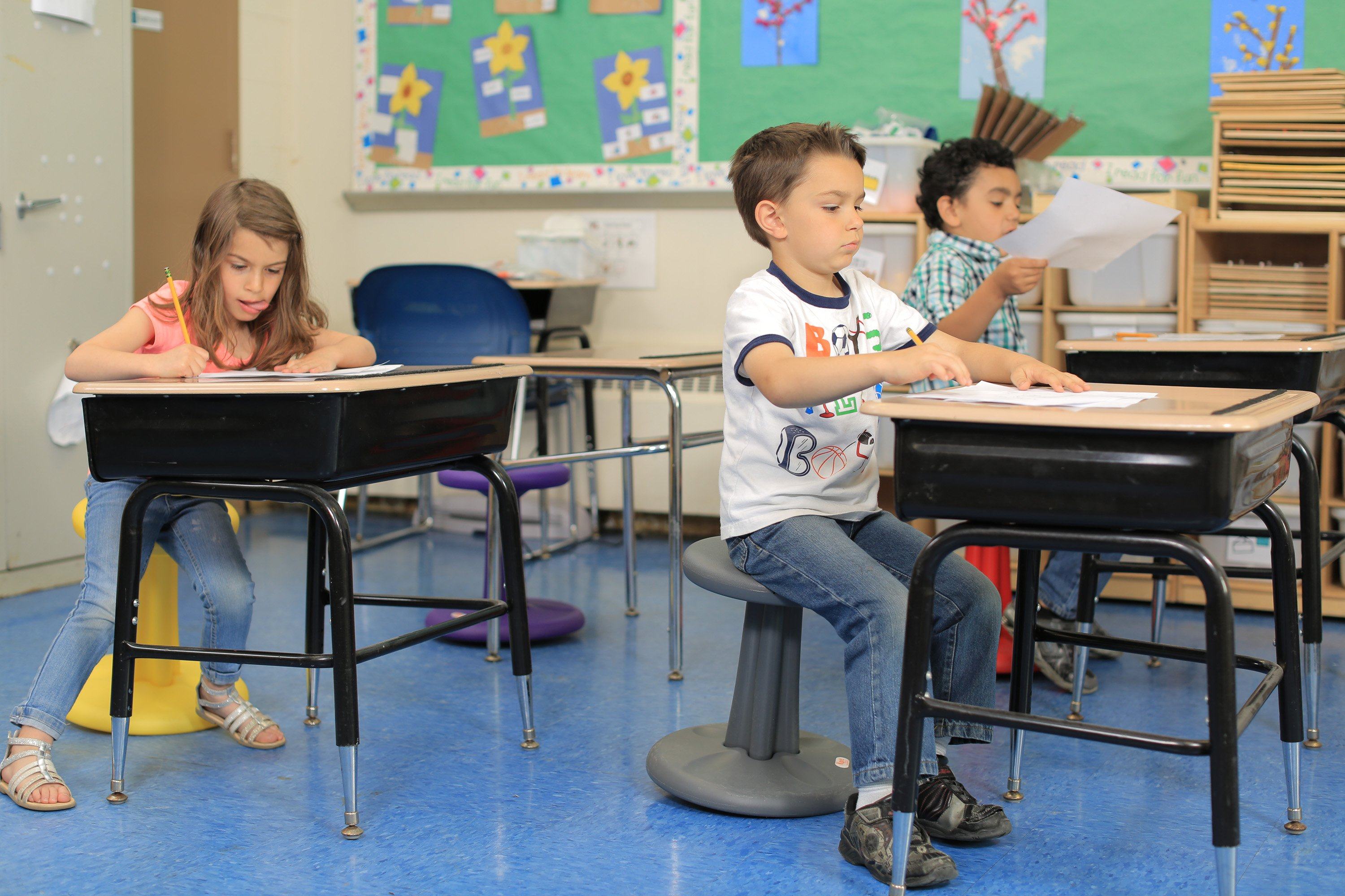 Kids using Kore Kids Wobble Chair 14" in classroom from Active Goods Canada