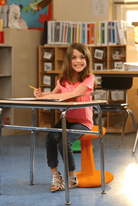 Girl sitting on Kore Pre-Teen Wobble Chair 18.7" in classroom from Active Goods Canada